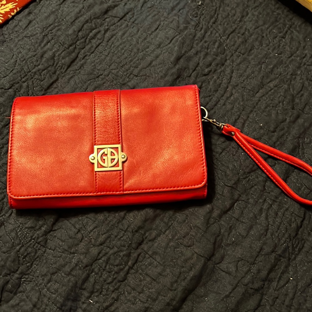 Red clutch with multiple pockets inside